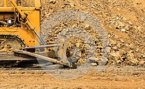 Industrial bulldozer moving earth pit or quarry