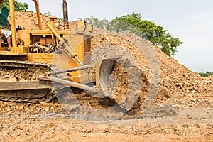 Industrial bulldozer moving earth pit or quarry