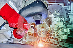 Industrial business concept with technician focus on welding process