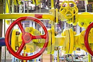 Industrial business. Gas-pipe. Yellow pipes and red gate valves