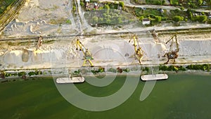 Industrial cargo port with cranes on the Danube river