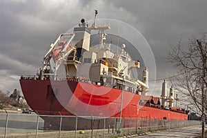 Industrial cargo ship sailing down the Welland Canal.