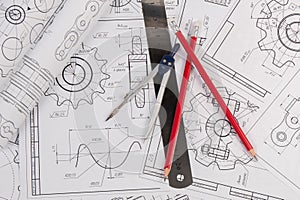 Industrial chain drawings, engineering compass, ruler and pencils