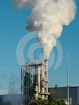 Industrial chimney expelling a lot of smoke