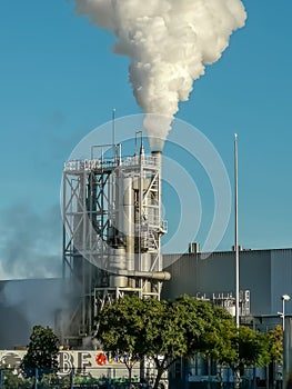 Industrial chimney expelling a lot of smoke