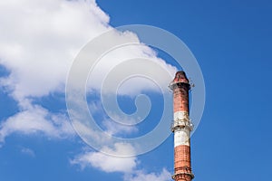 Industrial chimney painted in red and white
