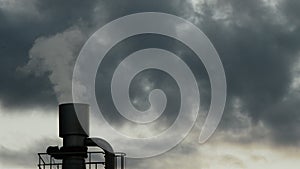 Industrial chimney or stack exhaling pollution smoke in industrial plant at cloudy day at sunset