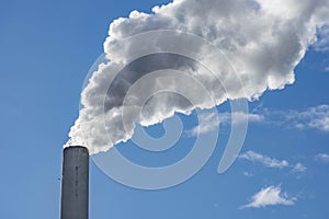 Industrial chimney, thermal power plant, pollution in the air, steam cooling tower in Graz, Styria region, Austria