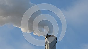 Industrial chimney with white co2 smoke