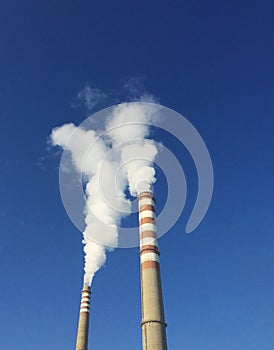 Industrial chimneys with smoke