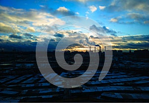 Industrial chimneys during sunset background