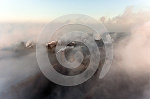 Industrial city of Mariupol, Ukraine, in the smoke of industrial plants and fog at dawn.