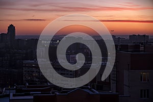 Industrial city night scene, soft pink sky