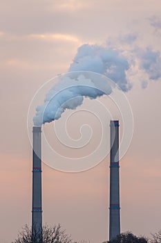 Industrial cityscape with coal power plant and smoke stacks