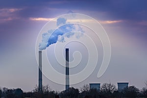 Industrial cityscape with coal power plant and smoke stacks