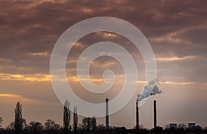 Industrial cityscape with coal power plant and smoke stacks