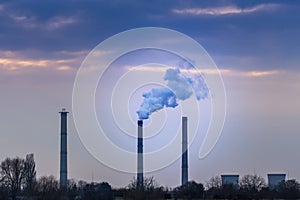 Industrial cityscape with coal power plant and smoke stacks