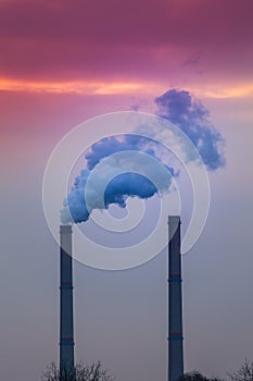 Industrial cityscape with coal power plant and smoke stacks