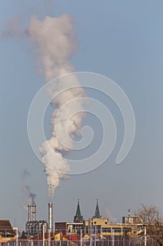 Industrial cityscape with smoke from coal powered plant