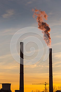 Industrial cityscape with smoke from coal powered plant