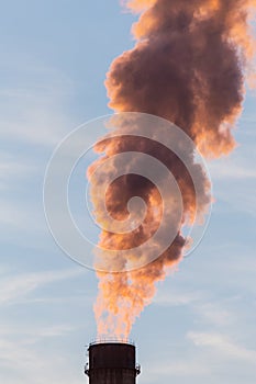 Industrial cityscape with smoke from coal powered plant