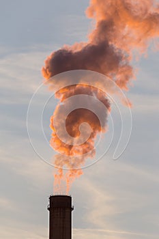 Industrial cityscape with smoke from coal powered plant