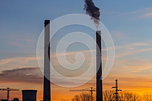 Industrial cityscape with smoke from coal powered plant