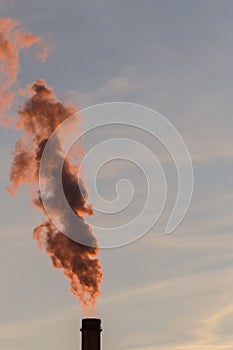 Industrial cityscape with smoke from coal powered plant