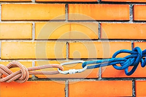 Industrial climbing work site. Rope access working and equipment on top of the high city building. Rope anchoring points and knots