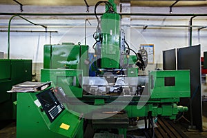 Industrial CNC machine tools in metalworking workshop