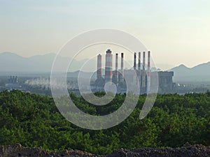 Industrial coal power plant with smokestack. Electric power gene