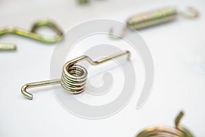 The industrial coil spring spare part on the white background.