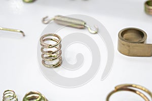 The industrial coil spring spare part on the white background.