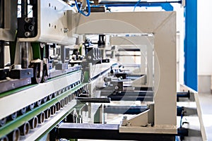 A industrial commercial envelope making machine, making paper envelopes for international distribution. Automated engineering