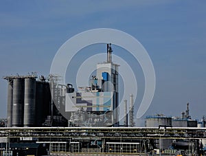 Industrial complex under a blue sky at high noon