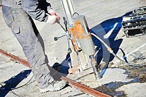 Industrial concrete drilling at construction demolition work