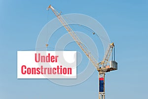 Industrial Construction crane holding a billboard