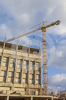 Industrial Construction Site With Mid-Size Crane In Process.HDR Toning.