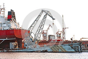 Industrial container cranes and ship at the shipyard docks of Ri