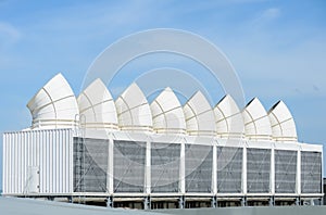 Industrial cooling towers on blue sky
