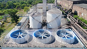 Industrial cooling towers with futuristic graphics. A futuristic shot of a factory exterior. Cooling tower from a drone