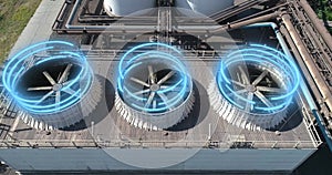 Industrial cooling towers with futuristic graphics. A futuristic shot of a factory exterior. Cooling tower from a drone