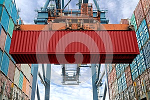 Industrial crane loading Containers in a Cargo freight ship. Con