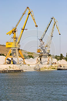 Industrial cranes in harbor