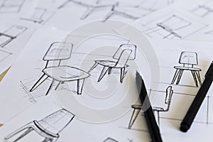 Industrial design sketching of ideas for chair concepts
