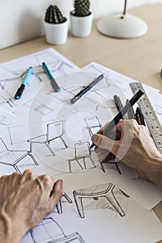 Industrial designer sketching ideas for a chair concept