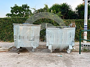 Industrial Efficiency: Tin Dumpster in Urban Setting