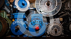 Industrial electric motors being repaired in a garage. Electrical equipment, asynchronous current generators, close-up