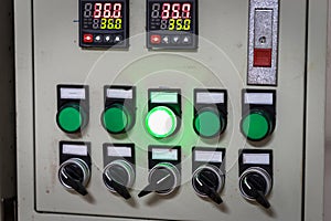 Industrial, electric switch panel with buttons in different colours.