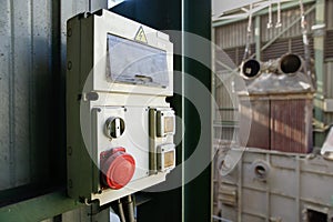 Industrial electricity cabin with red stop button